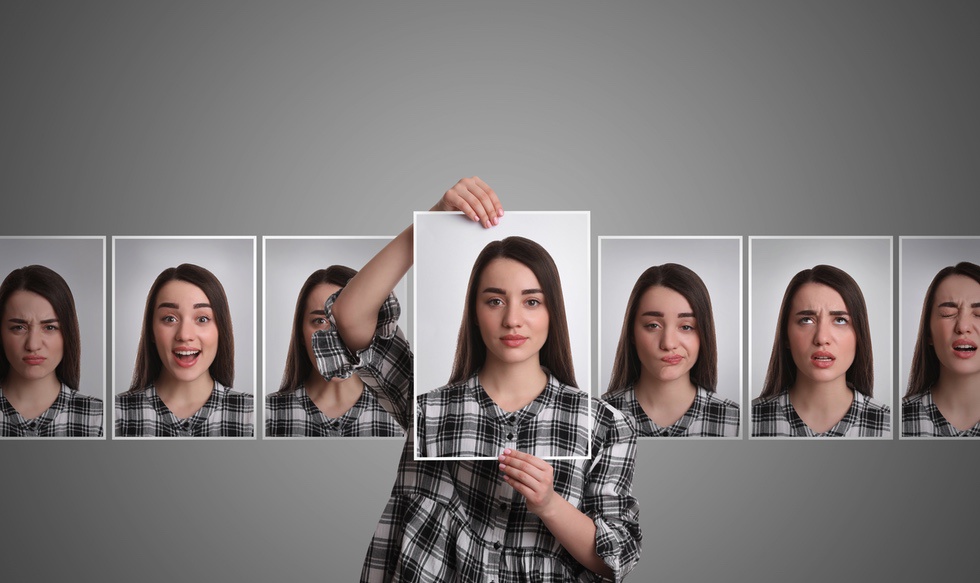 Woman holding up photo of her own calm face next to photos with other expressions to symbolize benefits of IFS